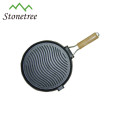 round vegetable oil cast iron skillet with wooden handle